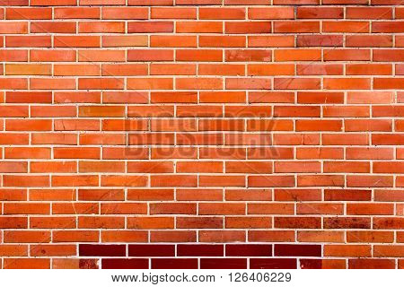 old repaired red orange brick wall for background