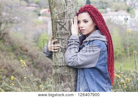 Woman Touching A Tree, Thinking.