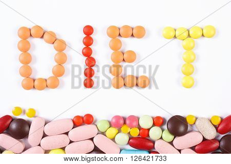 Inscription diet made of colorful medical pills tablets or supplements for therapy concept of treatment diet slimming and health care