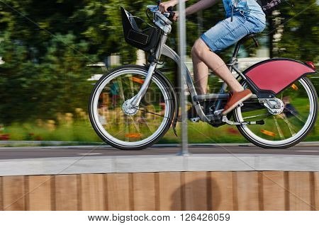 part of cyclist in motion on city background. Moskow Russia, Crimean embankment. about Park Muzeon Arts