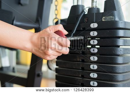 Exercise series : Adjusting weigh on exercise machine