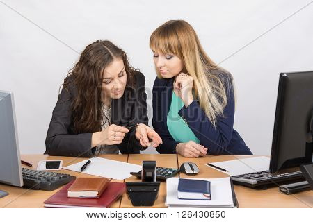 Young Office Workers Enthusiastically Discussing Lipstick At Your Desk
