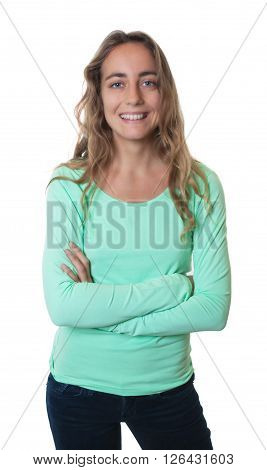 Laughing blonde caucasian woman with blue eyes and crossed arms on an isolated white background for cut out