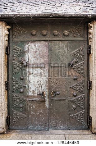 Massive old door in courtyard of famous Saint Stephen's cathedral in Passau Germany. Architectural element.