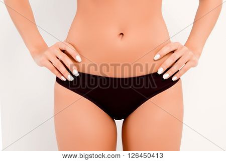 Close Up Photo Of  Black Women's Panties And Slim Belly