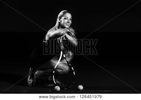 Portrait Of Young Beautiful Woman Playing Tennis