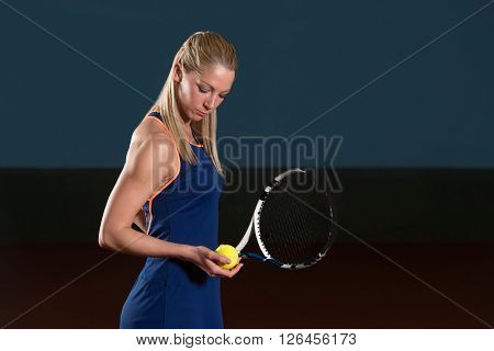 Woman With Tennis Racket And Tennis Balls