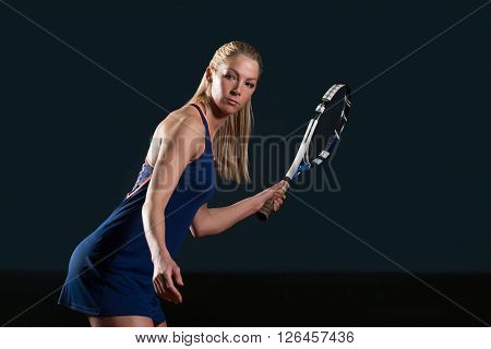 Tennis Player Hitting The Ball On Tennis Court