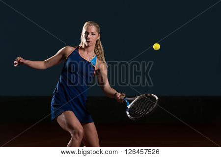 Tennis Player Hitting Tennis Ball