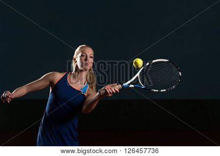 Tennis Player Hitting Tennis Ball