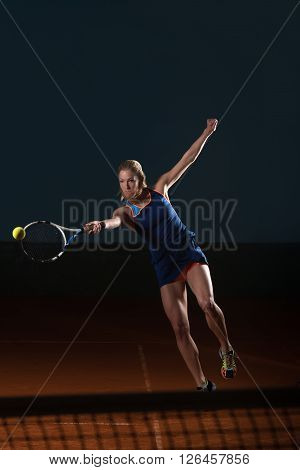 Tennis Player Hitting Tennis Ball
