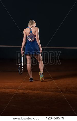 Woman With Tennis Racket And Tennis Balls