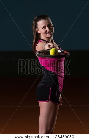 Young Attractive Woman Playing Tennis