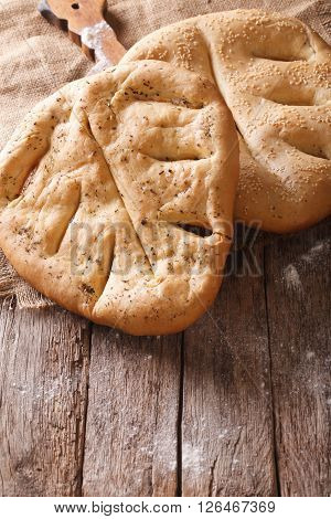 Fugasse French Bread Closeup On The Table. Vertical, Rustic