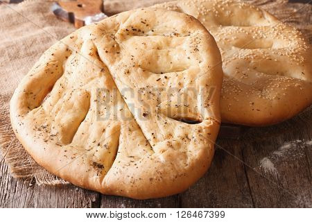 Homemade Fugasse French Bread With Sesame Seeds And Herbs Closeup