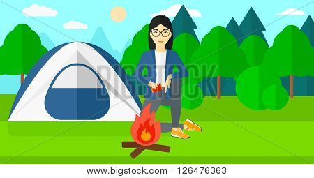 Woman kindling fire.