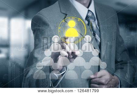 Hand carrying businessman icon network - HRHRMMLM teamwork and leadership concept.