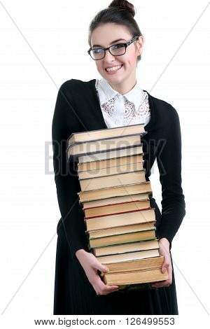 Young woman with books pile isolated on white