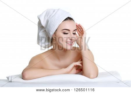 Young spa woman touching her face after beauty treatment