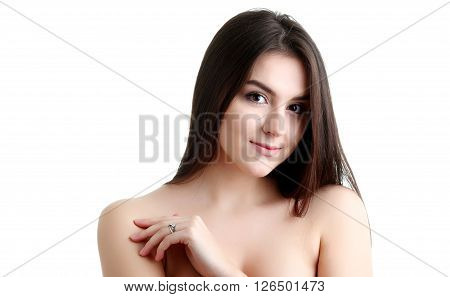 Young spa woman touching her face after beauty treatment