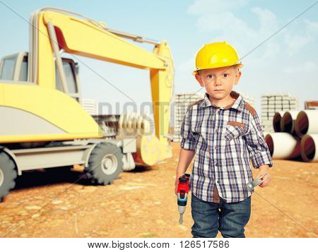 little handyman at construction site