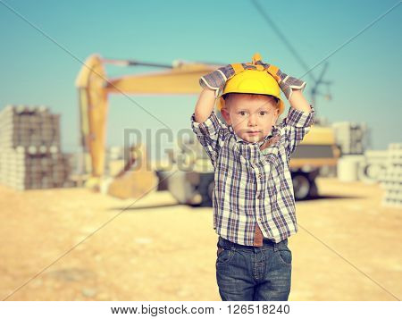 little handyman at construction site