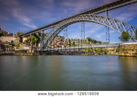 City of Porto in Portugal. Ponte Luiz I Bridge over Douro river and historic architecture of the Old Town.