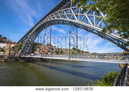 City of Porto in Portugal. Ponte Luiz I Bridge over Douro river and historic architecture of the Old Town.