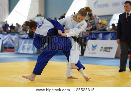 ST. PETERSBURG, RUSSIA - APRIL 16, 2016: Match Daria Pichkaleva (white) vs Aida Bikbova, both of Russia, during the Junior European Judo Cup. Athletes from 22 countries participated in the competition