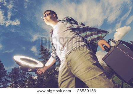 Mobile Flashlight Strobelight Photography Funny Concept. Young Men Enjoying Storbe Light White Caring and Using Flashlight on Himself. Mobile Flash Lighting Men