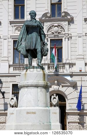 Statue of Lajos Kossuth and governmental building in Pecs Hungary.