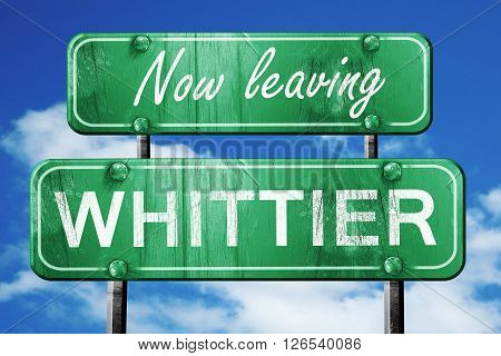 Now leaving whittier road sign with blue sky