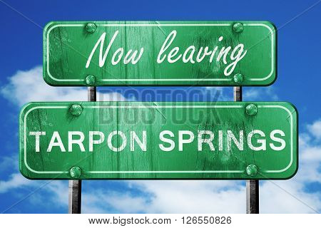 Now leaving tarpon springs road sign with blue sky