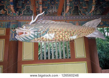 GYEONGJU CITY, NORTH GYEONGSANG PROVINCE / KOREA - CIRCA 1987: A sculpture of a large fish hangs under a roof at the historic Bulguksa Buddhist temple, which is a UNESCO Heritage Site.