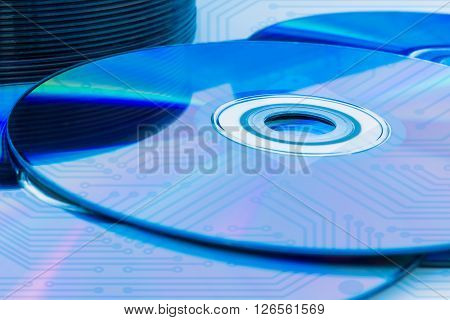 Closeup of a stack compact discs (CD/DVD) with the circuit board