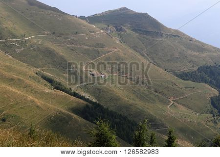 Net of curved paths on the mountain hill sides