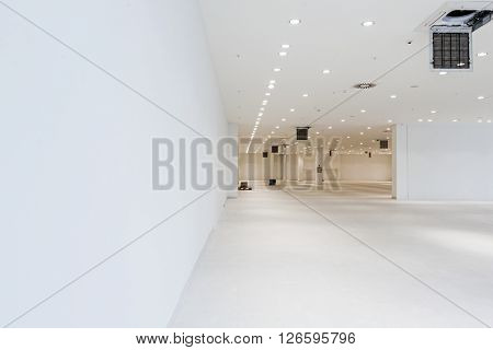 Interior of empty unfinished modern mega market. Architecture concept. Empty white room has white walls.