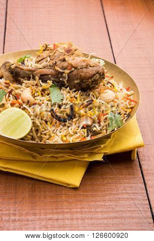 authentic chicken biryani with leg piece, prepared in basmati rice