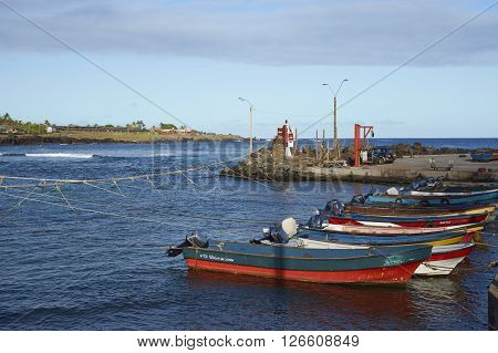 HANGA ROA, EASTER ISLAND, CHILE - APRIL 7, 2016: Fishing boats in a small harbour in HANGA ROA, capital of Easter Island.