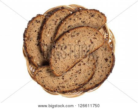 Sliced bread with sunflower seeds raisins and nuts in plate isolated on white background top view