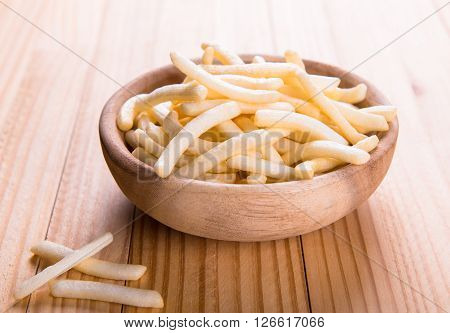 bowl of french fries on wood table