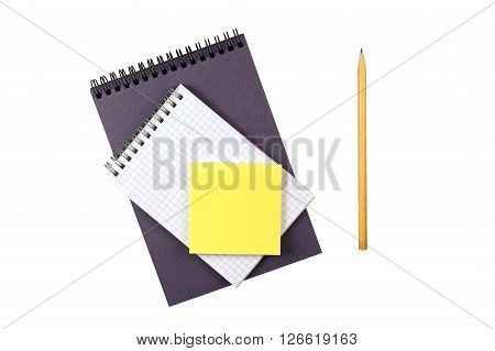 two Notepad with a pencil and yellow stickers on a white background