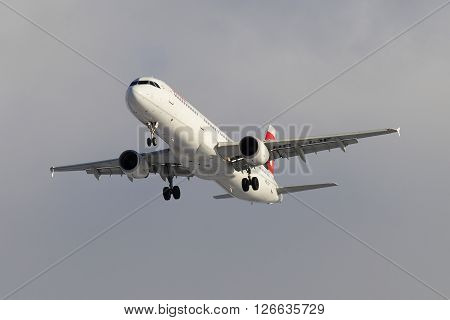 ST. PETERSBURG, RUSSIA - FEBRUARY 17, 2016: Flying Airbus A321-111 (HB-IOF) of the company Swiss International Air Lines, cloudy sky