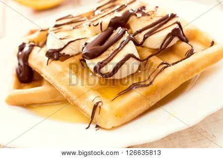 Belgium traditional waffels and banana.Selective focus on the front waffel