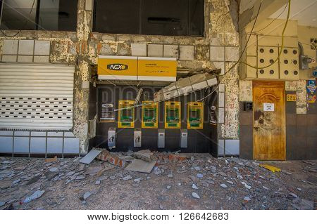 Portoviejo, Ecuador - April, 18, 2016: Pichincha Bank with ATM showing the aftereffect of 7.8 earthquake that destroyed the city center.