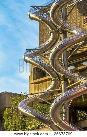 LONDON, UK - JUNE 6, 2015:Metal spiral pipes on the stone building wall for fire brigade downhill at Lambeth district