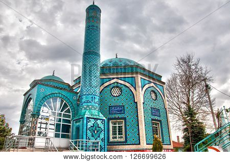 Tiled mosque and clouds on background in Kutahya, Turkey