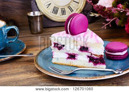 Sweet and Colourful Cake with French Macaroons. Studio Photo
