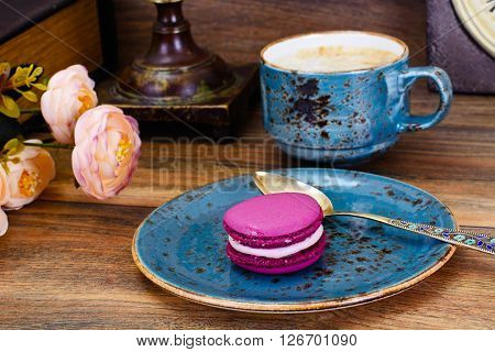 Sweet  French Macaroons with Cofee Cup. Studio Photo