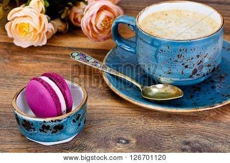 Sweet  French Macaroons with Cofee Cup. Studio Photo